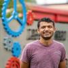 Jay Patel, a manufacturing engineering technology student at Pennsylvania College of Technology, stands outside the Larry A. Ward Machining Technologies Center on campus.