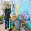Jonathan P. Bailey, an exercise science student from Philadelphia, helps clean up the children's vegetable garden at James V Brown Library.