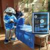 Penn College’s Wildcat mascot stops by a sales table for Comfy & Sweet, a retail operation set up by students in the college’s Business Planning and Operations class to raise money for a student scholarship fund. With the Wildcat is Michael D. Seitzer, of Williamsport, a student in business administration: management concentration.
