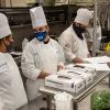 Pennsylvania College of Technology culinary arts students (from left) Alexis J. Muthler-Harris, of Williamsport; Charlie M. Suchanec, of State College; and Palin J. Hurst, of Gardners, consult during their Culinary Capstone course, in which each developed a five-course themed menu and served as chef de cuisine in the college’s Le Jeune Chef Restaurant, a live-learning lab for hospitality students that serves the public.