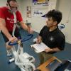 Penn College student Roberto Garcia Jr., who earned an associate degree in May, tracks a client’s performance using a V02 max calculator. The college’s exercise science major educates students in exercise physiology and how the body reacts to movement.