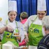 Students Tessa M. Stambaugh and Arielle E. White plate samples for Farm Show visitors.