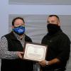 Diesel equipment technology instructor and Pennsylvania College of Technology alumnus John D. Motto (right) is presented with the 2021 Pathfinder to Excellence faculty award by Justin W. Beishline, assistant dean of diesel technology and natural resources. Motto was chosen for the same award in 2020; Beishline is a 2011 recipient.